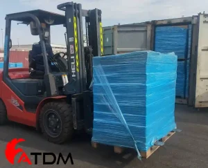Palletized blown asphalt and oxidized bitumen being loaded by forklift at ATDM shipping yard.
